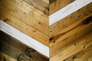 background of wooden boards of different types of wood laid diagonally