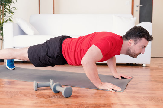 Handsome Man Workout With Push Ups At Home