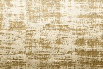 Gold surface of nap fabric, velours. Texture for background and design.