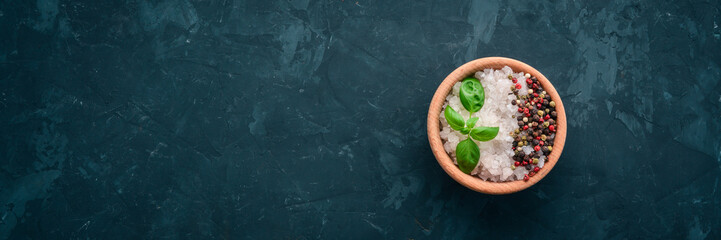 A set of spices and herbs on a stone table. Indian traditional spices. Top view. Free copy space.
