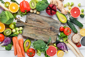 Fresh vegetables and fruits on a white wooden background. Healthy Organic Food. Top view. Free copy space.