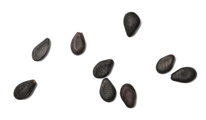 Black organic sesame seeds isolated on white background, macro and top view