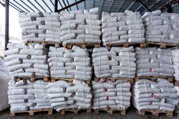 White polyethylene bags with factory products in warehouse