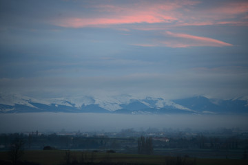 Dawn winter aurora in the snow-capped mountains surrounding the city of Vitoria-Gasteiz (Basque Country) Spain