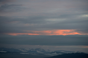 Dawn winter aurora in the snow-capped mountains surrounding the city of Vitoria-Gasteiz (Basque Country) Spain
