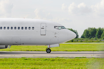 Passenger airplane portholes nose cockpit, side view