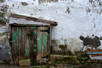 farmhouse with the old and chipped door in an old house in the town of Zambrana, Alava, Basque Country.