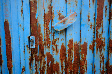 old and chipped garage door in the town of Zambrana, Alava (Basque Country)