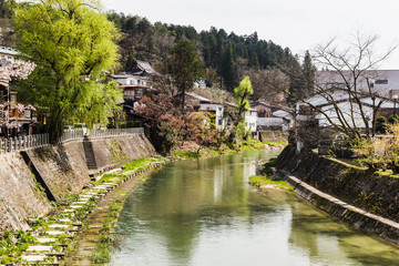 Fototapeta na wymiar Bridge and water canal in Takayama village of old Japan
