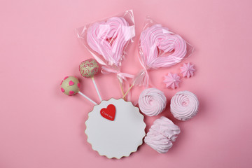 Variuos sweets on pink background
