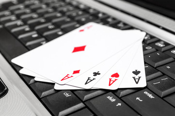 Aces on the laptop keyboard.