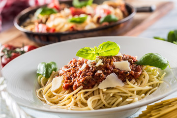 Close up italian pasta spaghetti bolognese in white plate