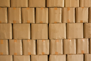 beige cardboard boxes stand in stack. rough surface texture