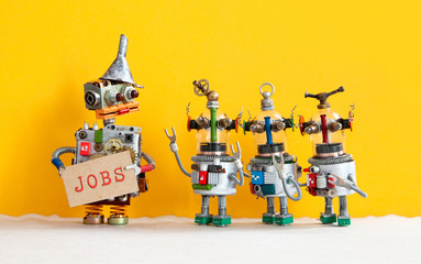 Three robots want to get a job and stand in a queue for an interview. Robot Director with cardboard...