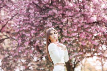 Fashion Art Beauty Portrait. Beautiful Girl in Fantasy Mystical and Magical Spring Garden. Model