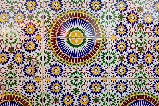 Old wall decorated with beautiful mosaics in Marrakech, Morocco