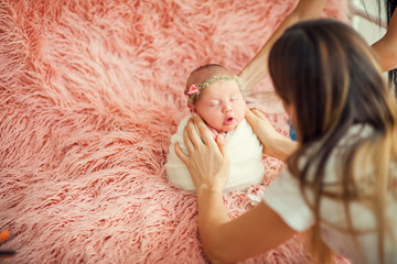 backstage of the shooting newborns. Photographer and child.