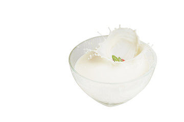 Spreads of milk from sweet strawberries on a white background.