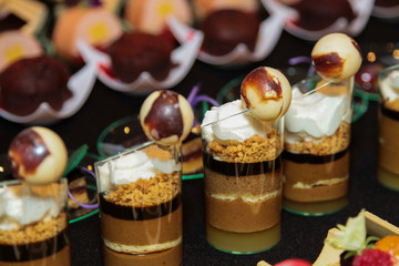 Dessert with chocolate, whip cream, chocolate and nuts