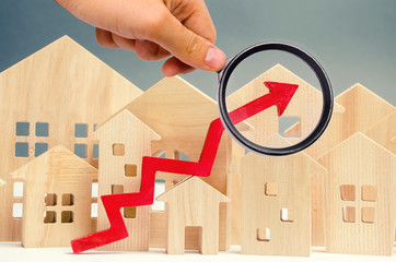 The concept of real estate market growth. The increase in housing prices. Rising prices for utilities. Increased interest in mortgage and rising interest rates on mortgages. Rent increase. © Andrii Yalanskyi