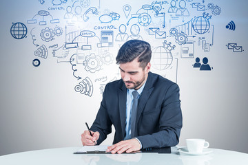 Man writing in clipboard, business plan