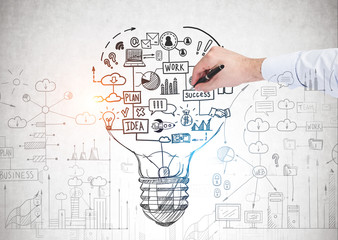 Man hand drawing business idea sketch