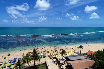 Aerial view of Porto de Galinhas beaches, Pernambuco, Brazil: unique experience of swimming with fishs in natural pools.  Beautiful landscape. Candles, sailboats, rafts, boats in the harbor!