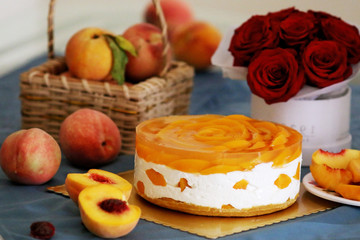 Peach mousse cake served with peaches