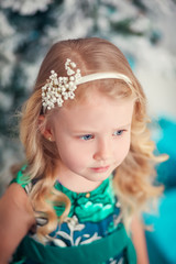 Little child girl near Christmas tree/Happy new year