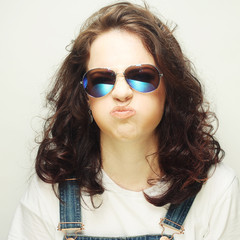 curly woman with sunglasses