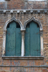 Two peeling windows in Venice Italy