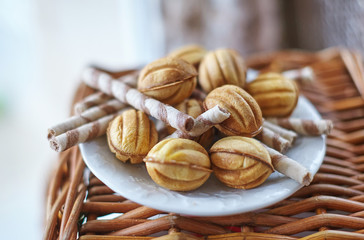 Traditional russian festive cookies in nut shape with caramelized milk inside
