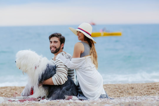 happy couple on the beach. Sea view with yellow boud
