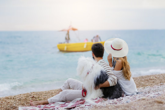 happy couple on the beach. Sea view with yellow boud
