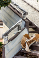 Stairway bannistor protected from paint spray