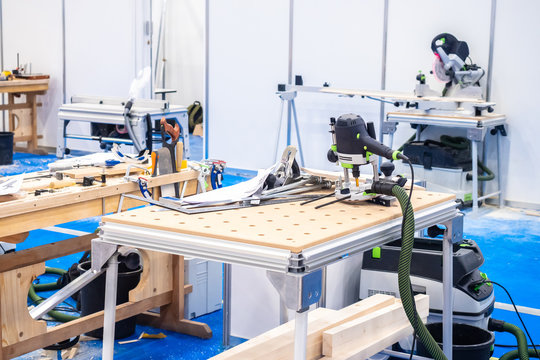 Carpentry workshop. Joinery equipment. Woodworking machine. Manual frezer. Crafting table.