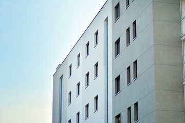 Modern apartment buildings on a sunny day with a blue sky. Facade of a modern apartment building