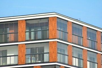 Modern apartment buildings on a sunny day with a blue sky. Facade of a modern apartment building