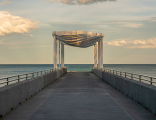 white pier at sunset