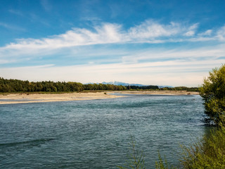 landscape with river and distant mountains