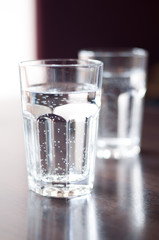 Glass with mineral water on the table