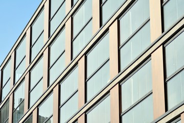 Fototapeta premium Modern apartment buildings on a sunny day with a blue sky. Facade of a modern apartment building