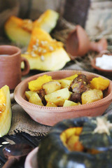 Baked whole pumpkin with potatoes