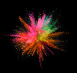 Multi colored powder explosion isolated on black