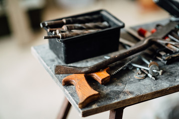 old work tool is on the table , small workroom with architecture dummy manufacturing