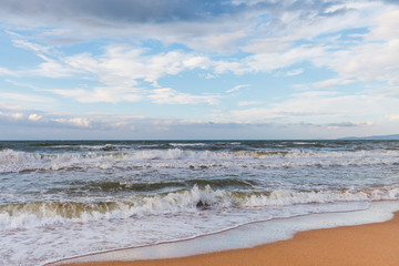Fototapeta na wymiar Calm waves on the beach. The storm is coming