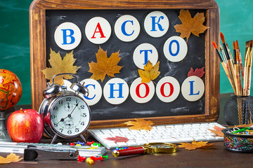 Back to school. Items for school classes in the composition on the table.