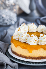 Delicious mango cheesecake decorated with whipped cream
