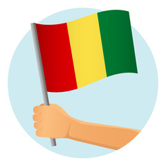 Guinea flag in hand