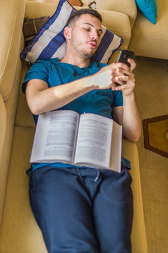 Man sending messages from his phone